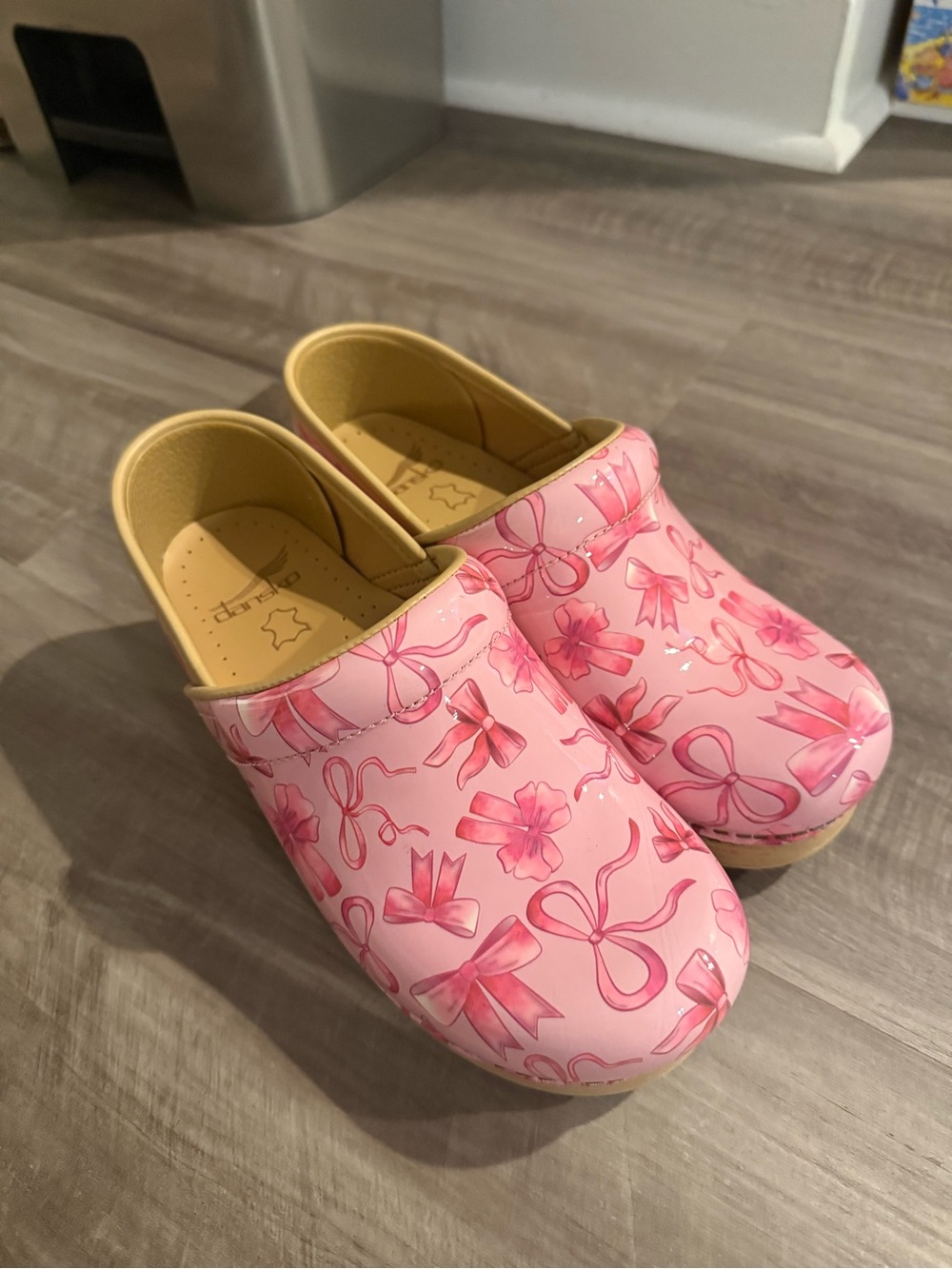 Dansko Pink Bow-Print Clogs